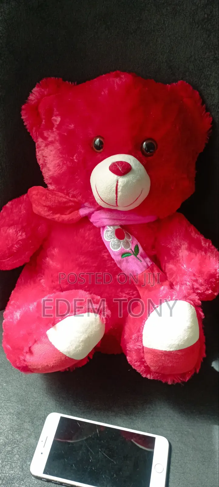 A Red Fluffy Teddy Bear With Dimensions 43×31cm