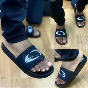 Corteiz Men's All-Black Rubber Slides.