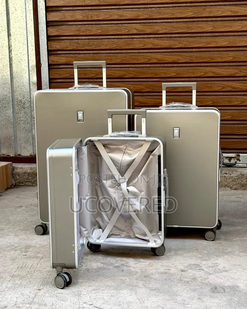 Hard-Shell Aluminum Trolley Suitcases Available as a Three-Piece Set.