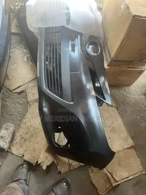 Toyota Vitz 2012 Front Bumper With Lower Grille Attached to It