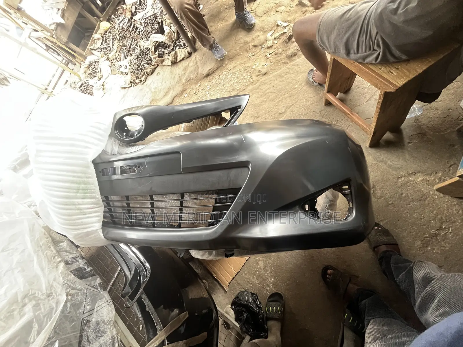 Toyota Vitz 2012 Front Bumper With Lower Grille Attached to It