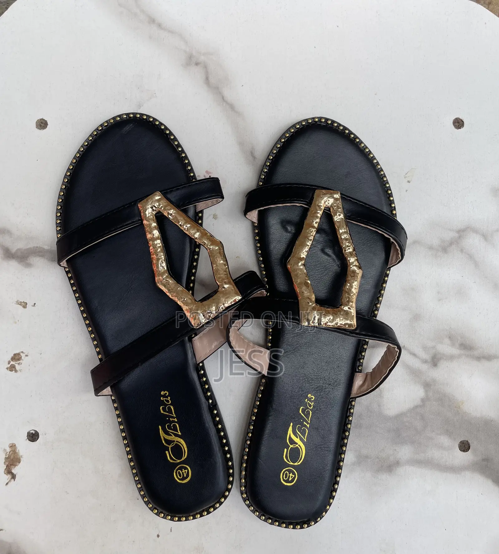 Black Faux Leather Slipper With Metallic Keyhole Design