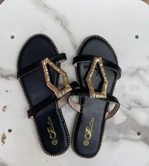 Black Faux Leather Slipper With Metallic Keyhole Design