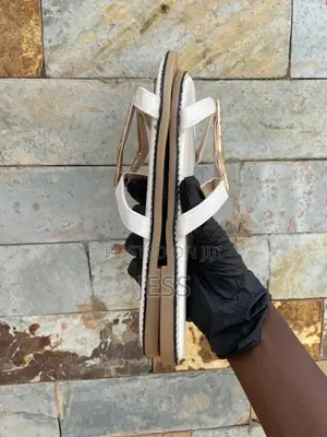 White, Faux Leather Slipper With Metallic Keyhole Design