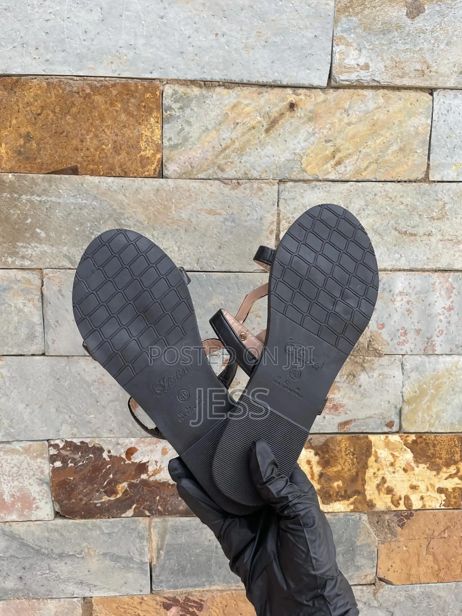 Black Faux Leather Slipper With Metallic Keyhole Design