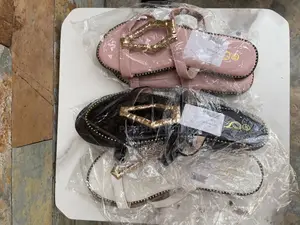Black Faux Leather Slipper With Metallic Keyhole Design