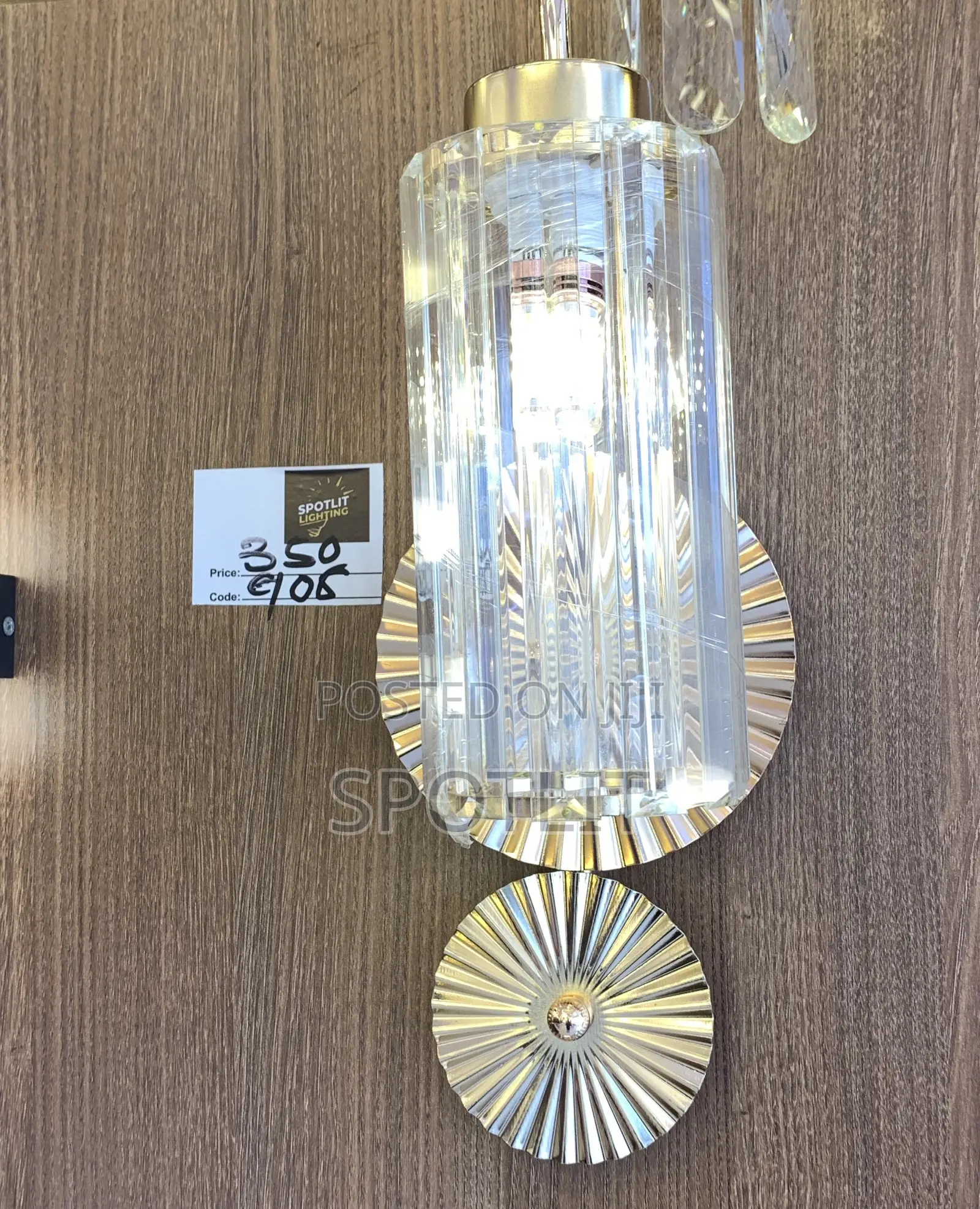 Wall Sconce Features a Fluted Glass Shade