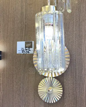 Wall Sconce Features a Fluted Glass Shade