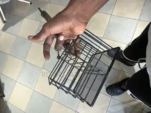 Black Metal Wire Caddy With A Wooden Handle For Organizing Picnic