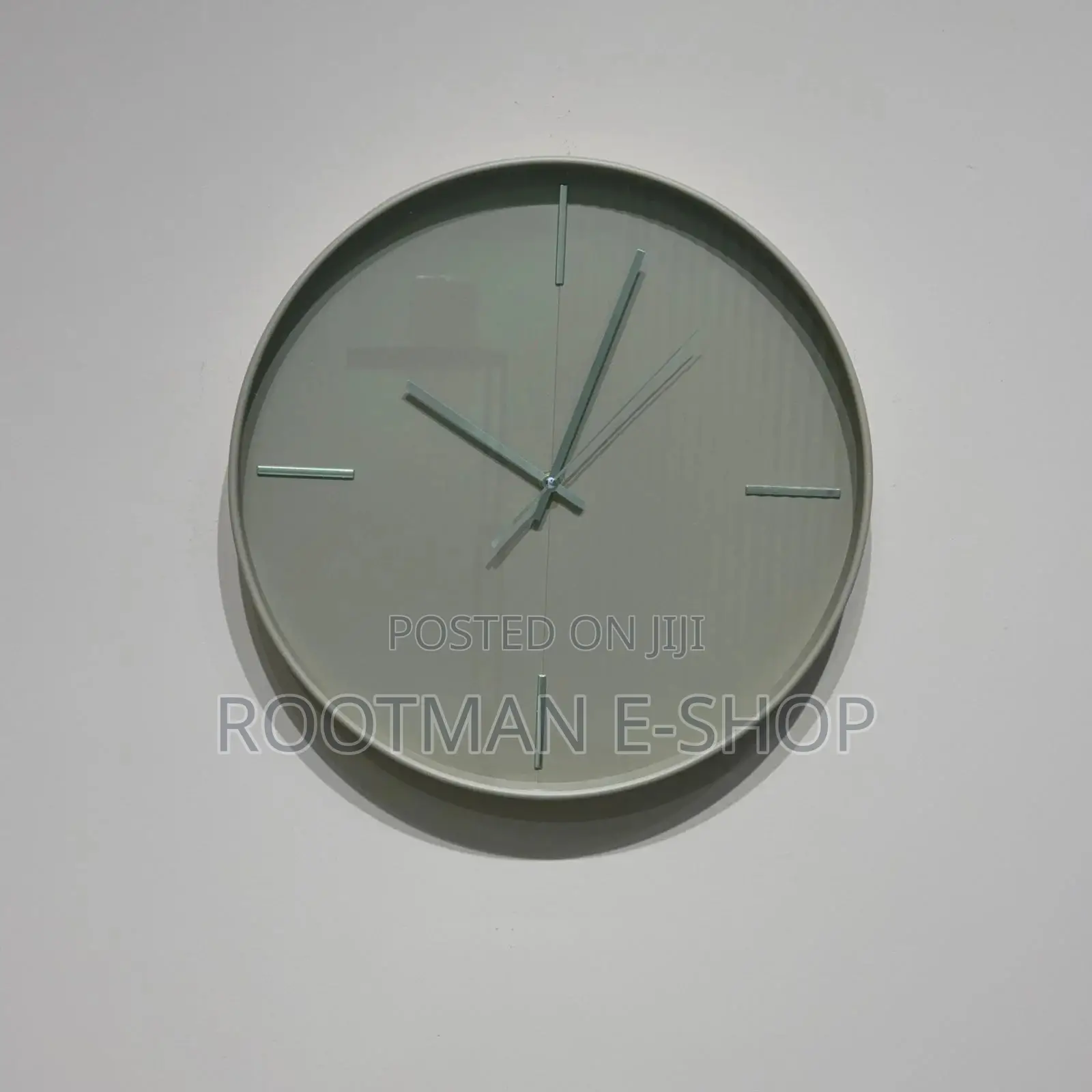 Circular Wall Clock Featuring a Minimalist, Grey-Toned Design