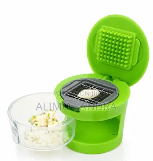 Multifunction Plastic Garlic Presser Crusher Slicer Storage Tool.