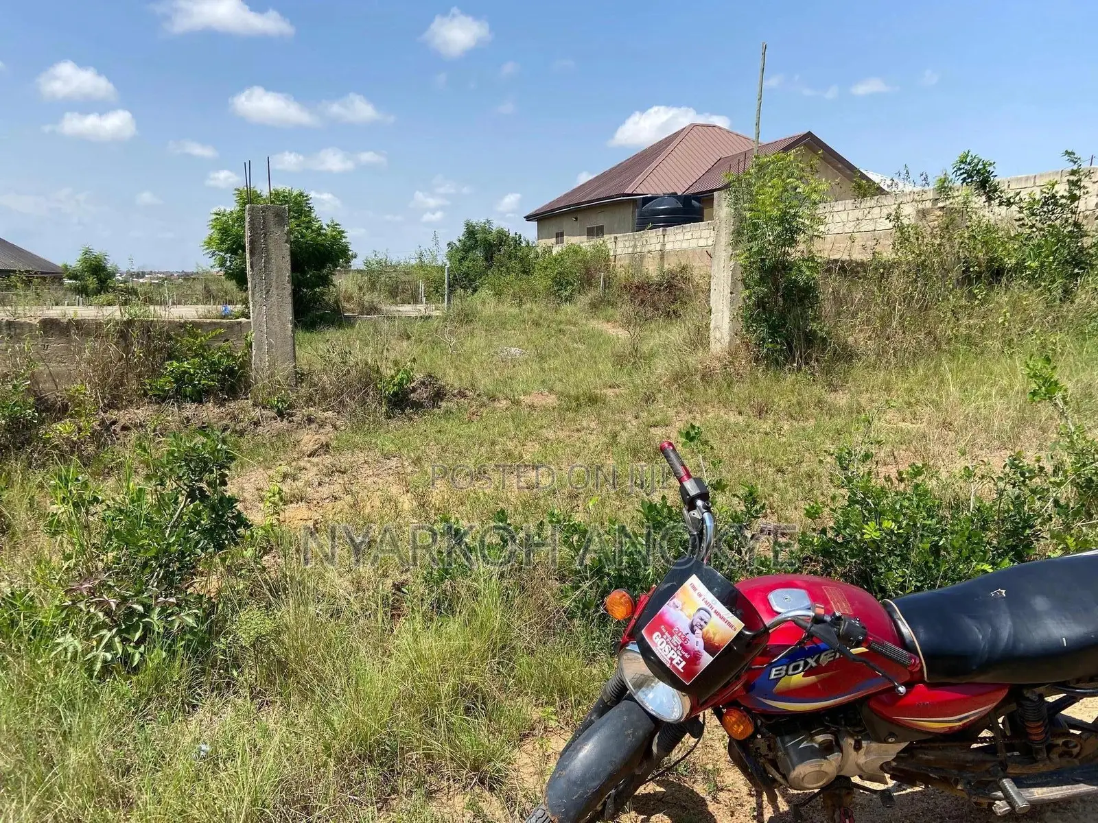 4 Story Building Footing On A Two Plot Of Land With Fenced Wall