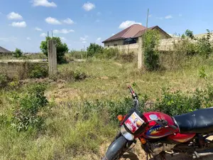 4 Story Building Footing On A Two Plot Of Land With Fenced Wall