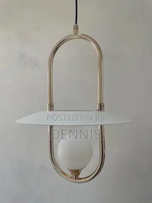 A Modern Brass And White Pendant Light