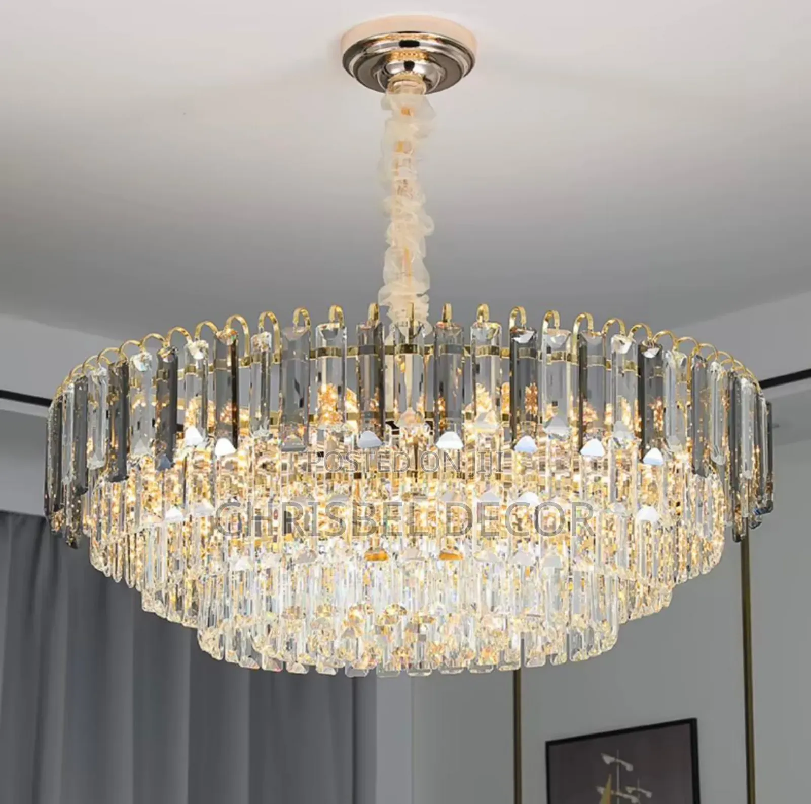 A Gold Toned Circular Crystal Chandelier.