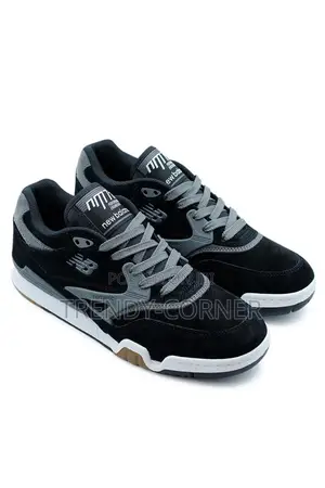 New Balance Numeric 770 in the "Black / Grey" Colorway.