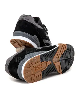 New Balance Numeric 770 in the "Black / Grey" Colorway.