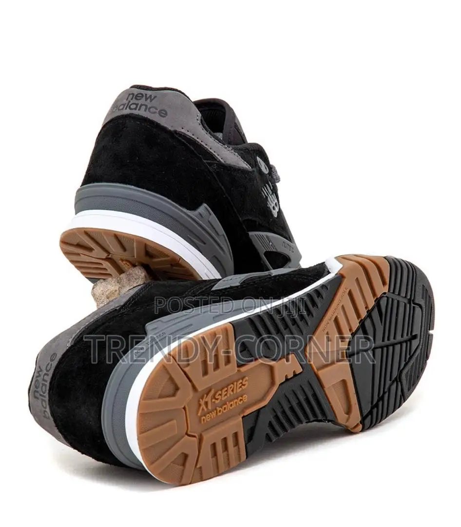 New Balance Numeric 770 in the "Black / Grey" Colorway.