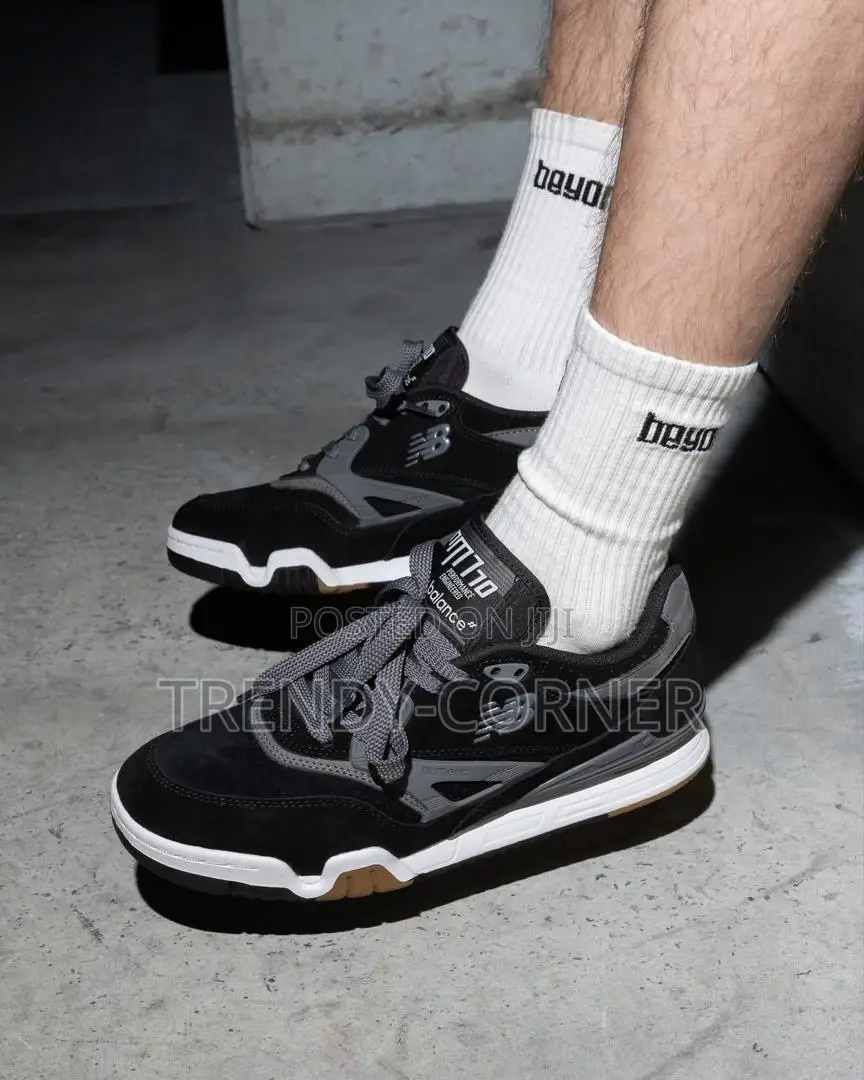 New Balance Numeric 770 in the "Black / Grey" Colorway.