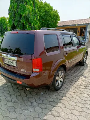 Honda Pilot Touring w/RES/Navi 4WD (3.5L 6cyl 5A) 2012 Burgundy