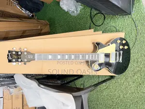 Black Gibson Les Paul Standard Electric Guitar.