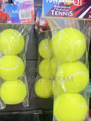 Three Packed Lawn Tennis Balls