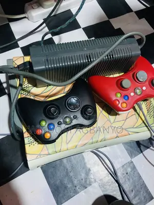 Xbox 360 With Two Controllers and 5 Video Games for Sale