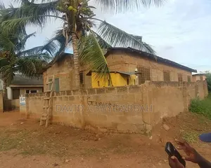 A Plot of Land and an Uncompleted Building for Sale at Abokobi