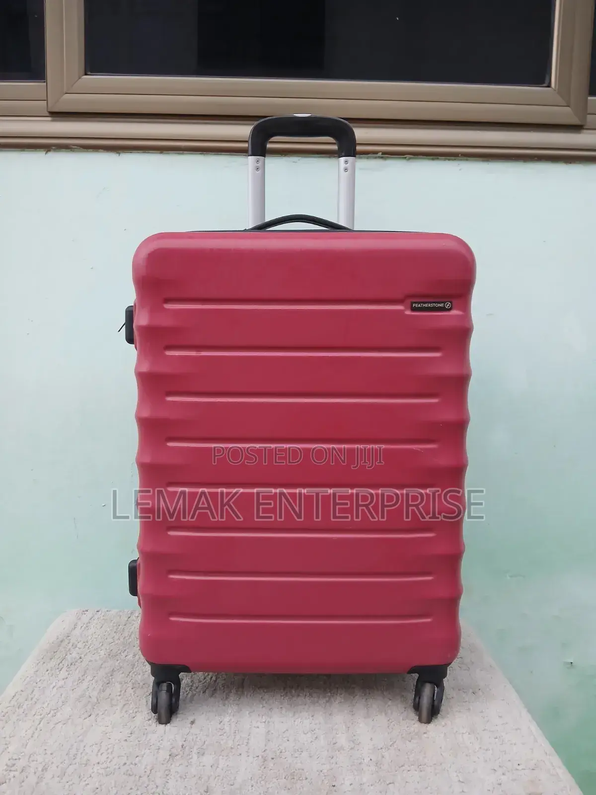 Featherstone Hard-Shell/ Traveling Suitcase . Red Color
Medium Size