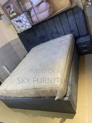 Oversized Double Bed With a Mattress Side Drawers