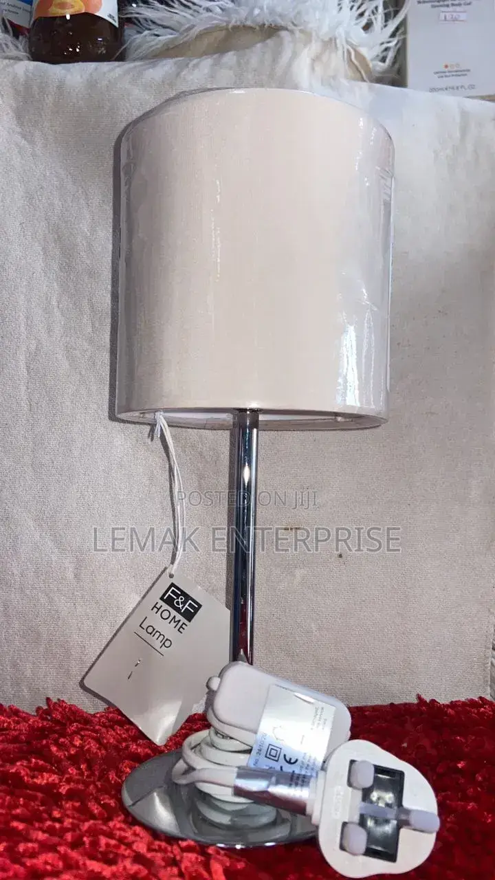 Modern Chrome Table Lamp With Glossy White Drum Shade.