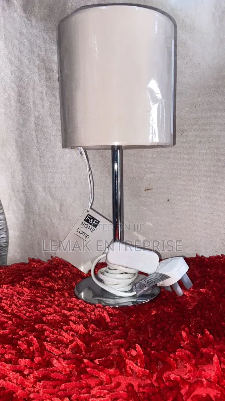 Modern Chrome Table Lamp With Glossy White Drum Shade.