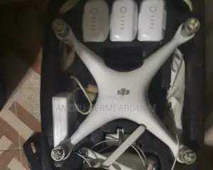 Dji Phantom 4 With 3 New Batteries and Bag Pack