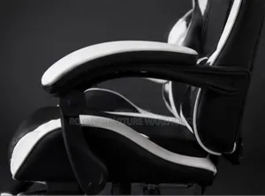 Black/White Ergonomic Gaming Chair With Footrest and Headrest Pillow.