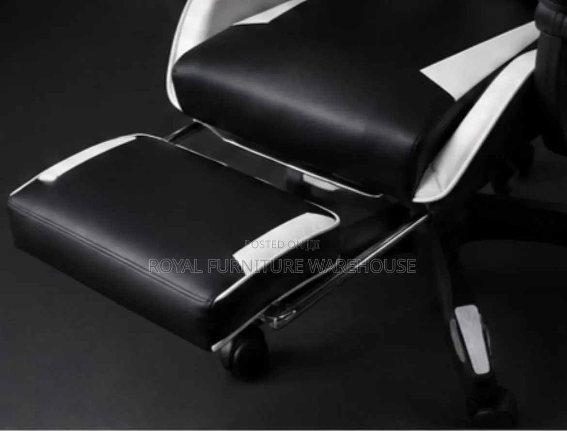 Black/White Ergonomic Gaming Chair With Footrest and Headrest Pillow.