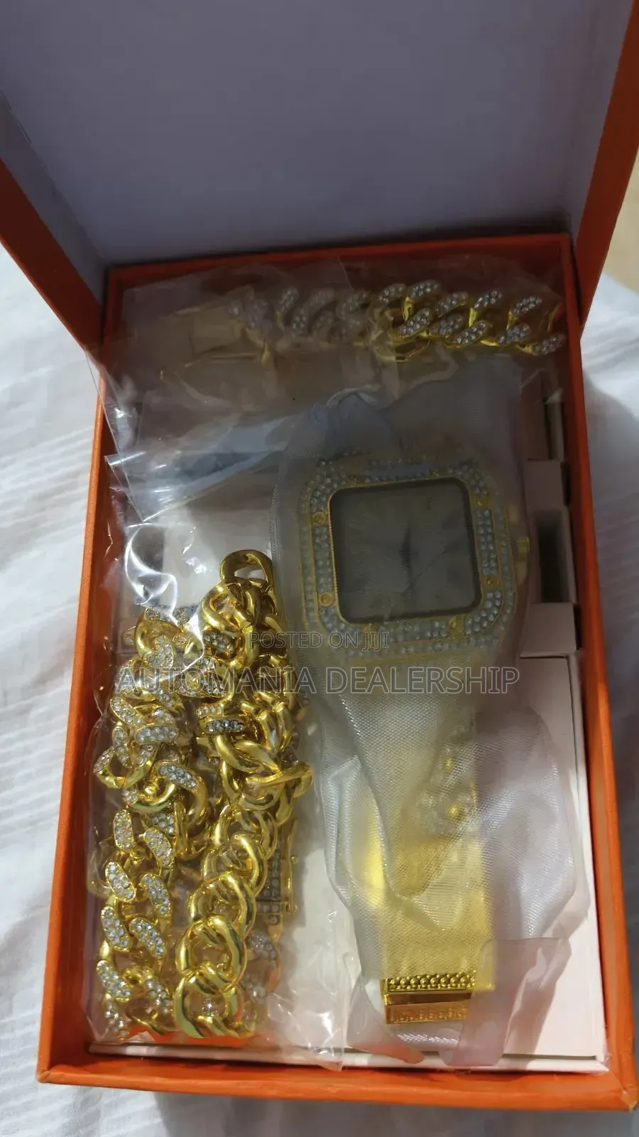 Men's Iced Out Gold Watch With Cuban Link Chain and Bracelet.