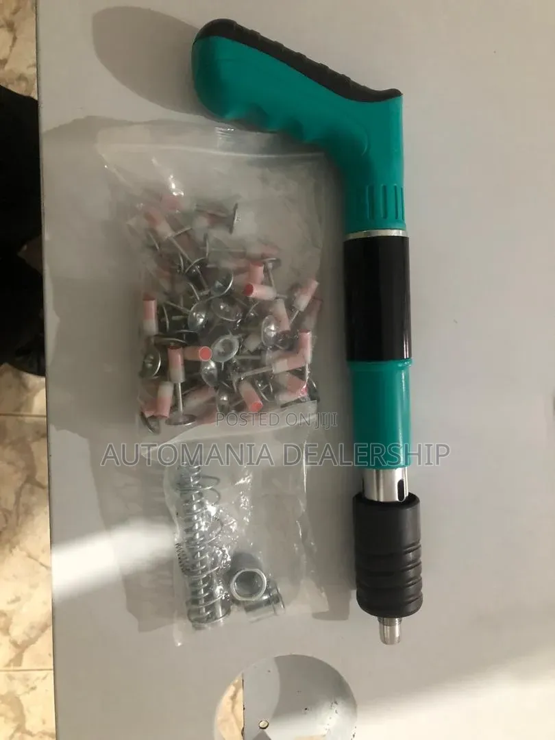 Nail Gun With Nails, Glasses and Fasteners