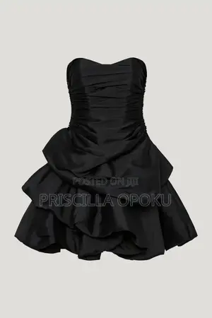 Mini Dress Features a Distinctive Tiered Ra-Ra Skirt A