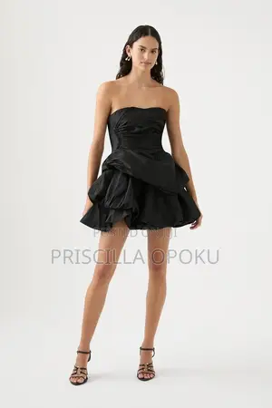 Mini Dress Features a Distinctive Tiered Ra-Ra Skirt A