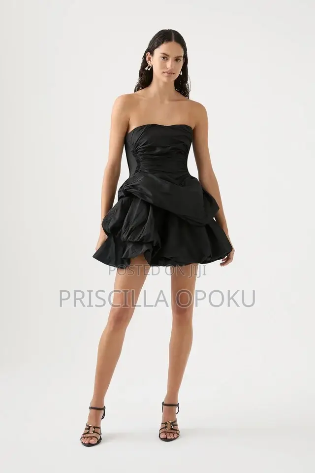 Mini Dress Features a Distinctive Tiered Ra-Ra Skirt A