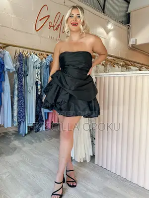 Mini Dress Features a Distinctive Tiered Ra-Ra Skirt A