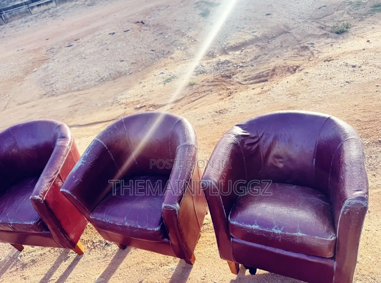 Deep Maroon Leather Tub Chairs.
