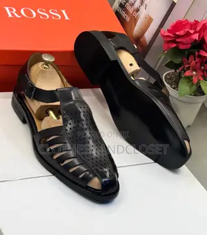 Black Leather Sandals Feature a T-Strap Design