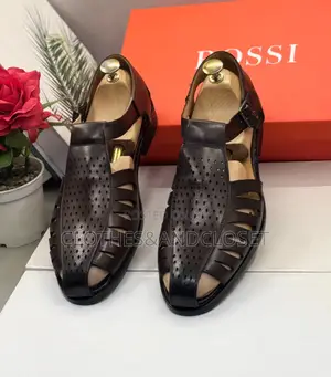 John Foster Leather Shoe Sandals Feature a Brown Perforated Upper