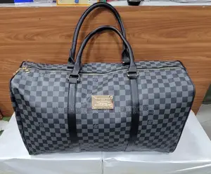 Louis Vuitton Keepall Bandoulière Duffle Bag.