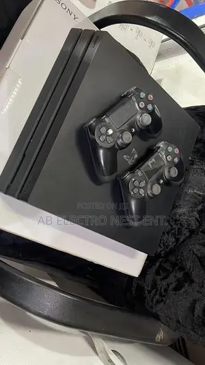 Neat Ps4 Pro With 4 Games Installed With 2 Controllers