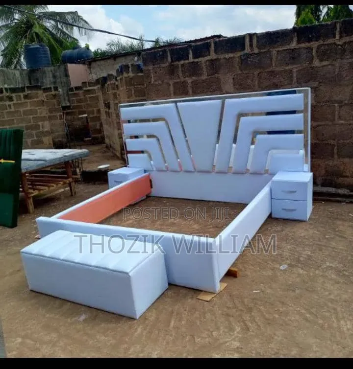 A Grand Double Bed Frame With Side Drawers and Automan