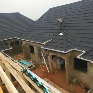 Black Euro Tiles and Rain Gutter Installation