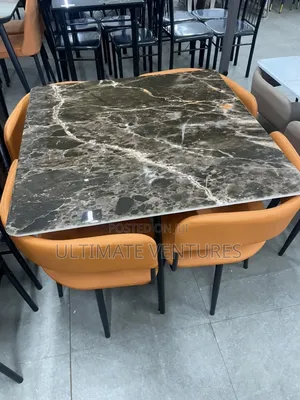 Modern 4-Seater Black Marble Dining Set With Orange Chairs