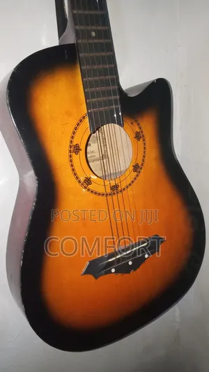 Neat Looking Acoustic Guitar With All Components Functioning Well.
